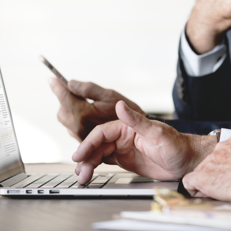 Businessmen using computer laptop